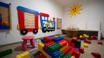 Playful space for kids to build and explore with a colorful train playset and building blocks.