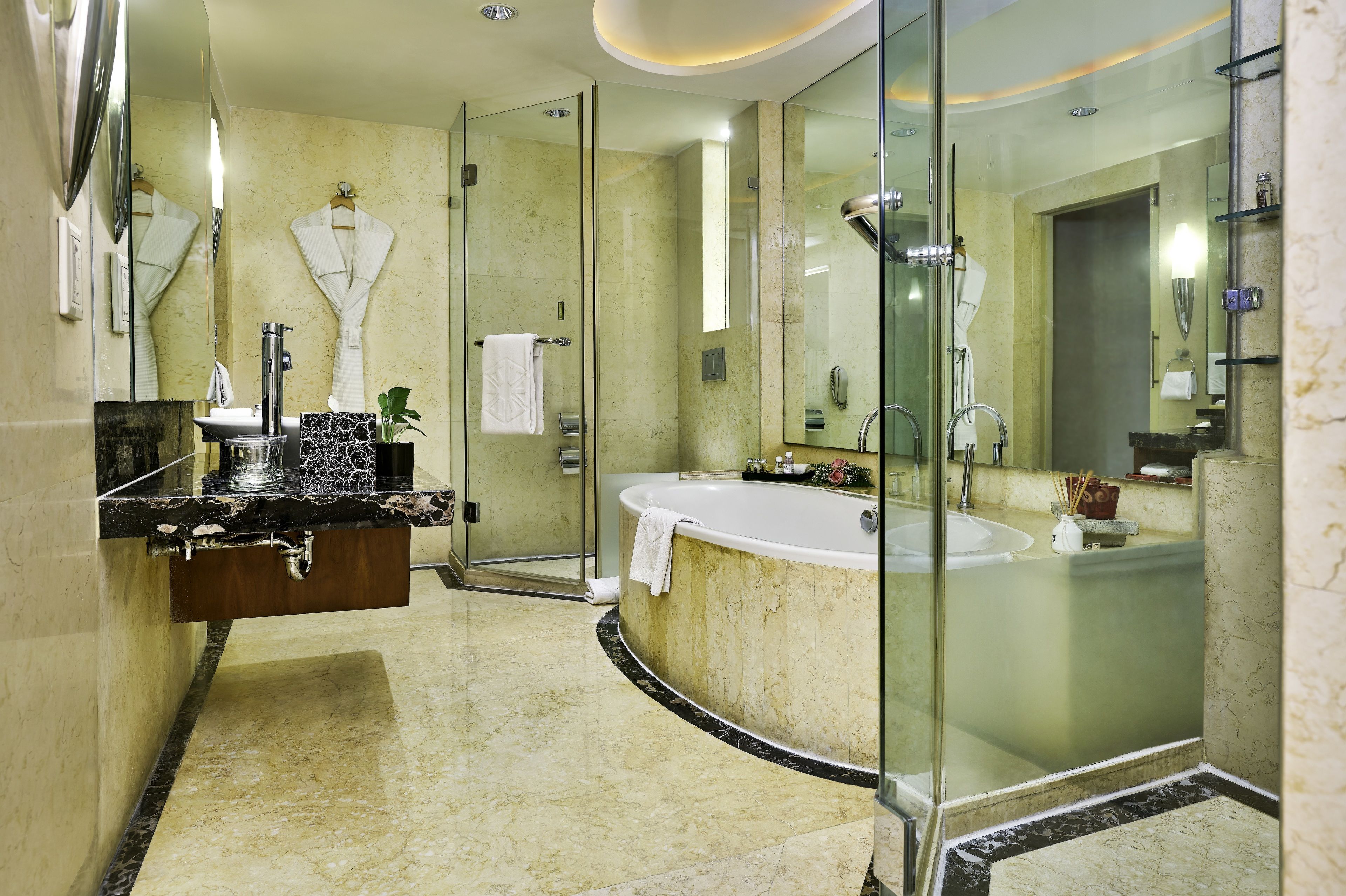 deluxe suite, 1 bedroom | bathroom | shower, free toiletries, hair dryer, dressing gowns