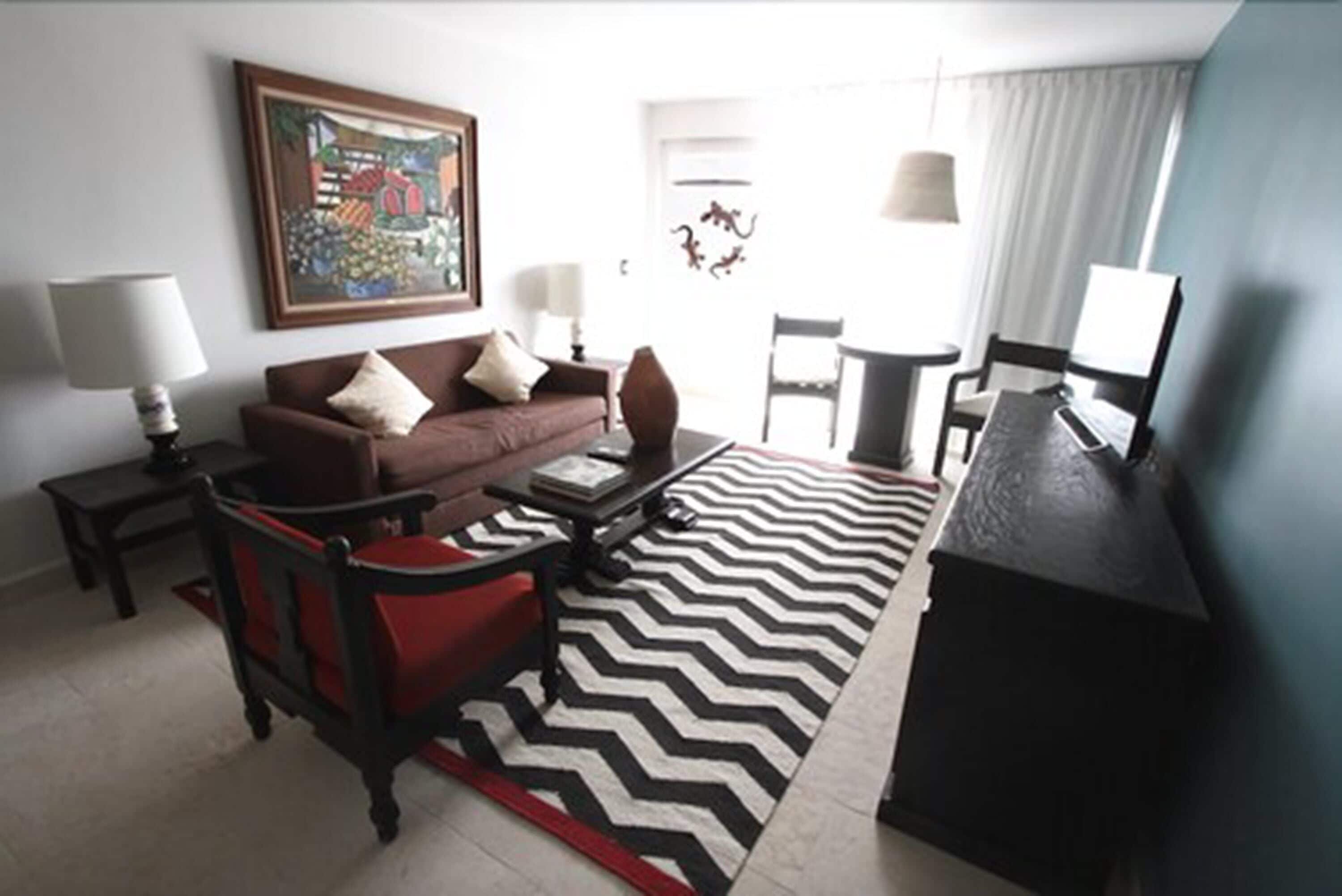 luxury suite, hot tub, garden view | living area | 32-inch lcd tv with cable channels, tv