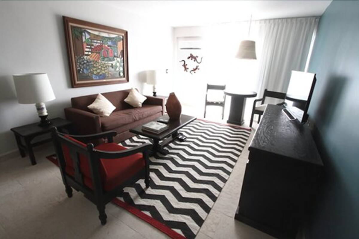 luxury suite, hot tub, garden view | living area | 32-inch lcd tv with cable channels, tv