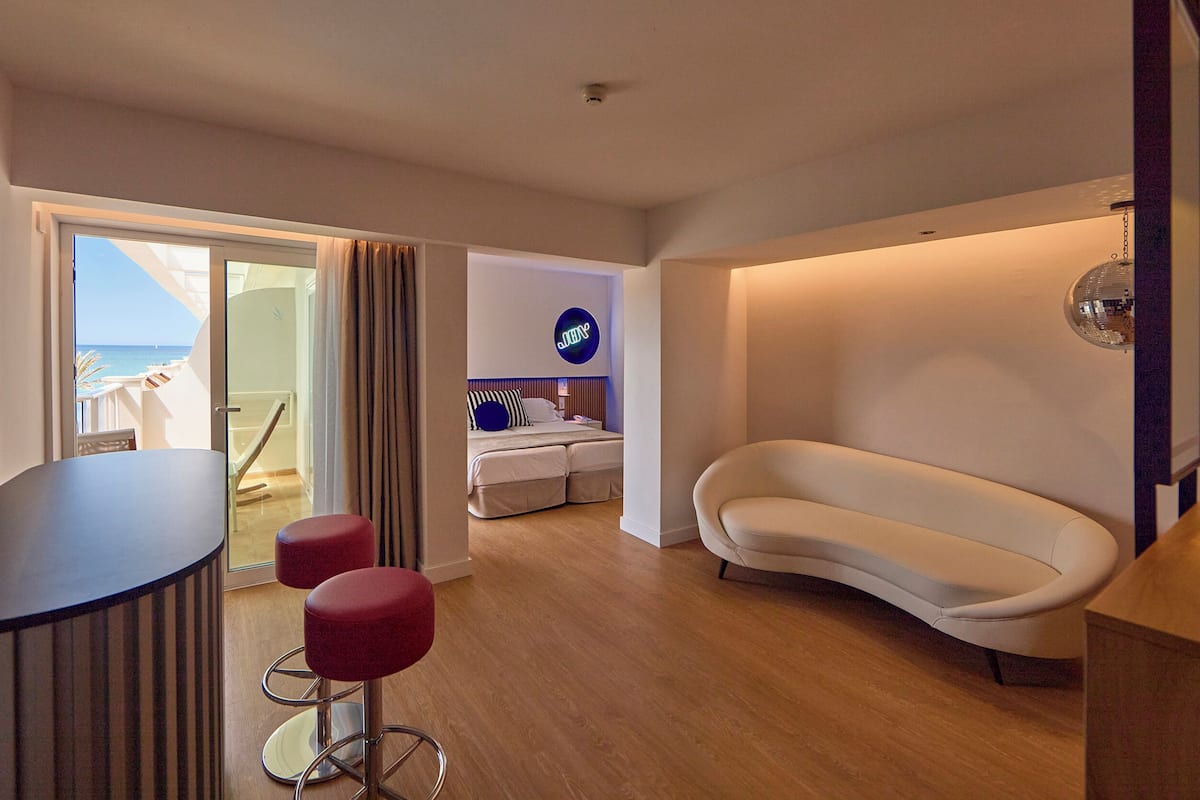 Suite, Balcony, Partial Sea View (Lateral) | Living area | 40-inch flat-screen TV with satellite channels, TV