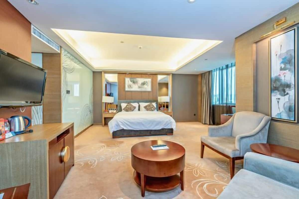 Seprai premium, selimut bulu angsa, minibar, dan brankas