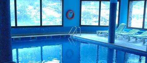 Indoor pool, outdoor pool, open 8:00 AM to 8:00 PM, pool loungers