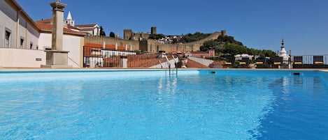 Seasonal outdoor pool, pool umbrellas, pool loungers