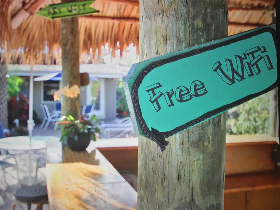 A wooden sign with "Free WiFi" written on it.