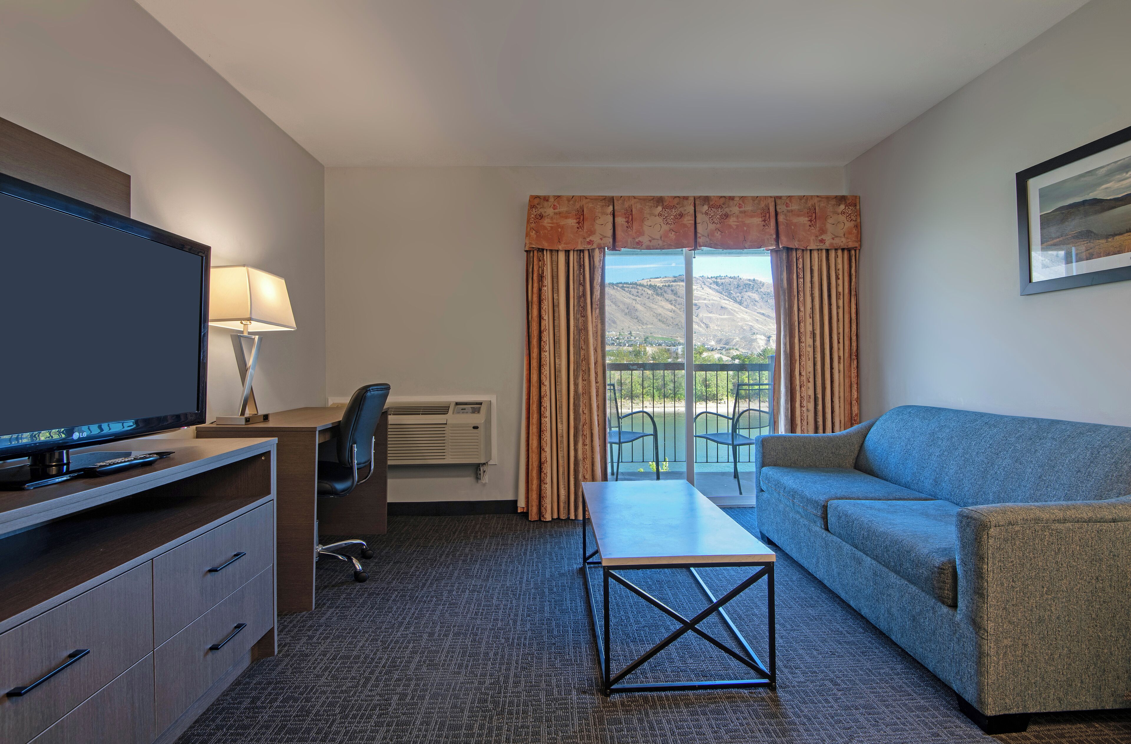 Suite, 1 Bedroom, Kitchenette, River View | Living area | 32-inch LCD TV with cable channels, TV