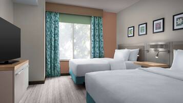 Ropa de cama de alta calidad y caja de seguridad en la habitación