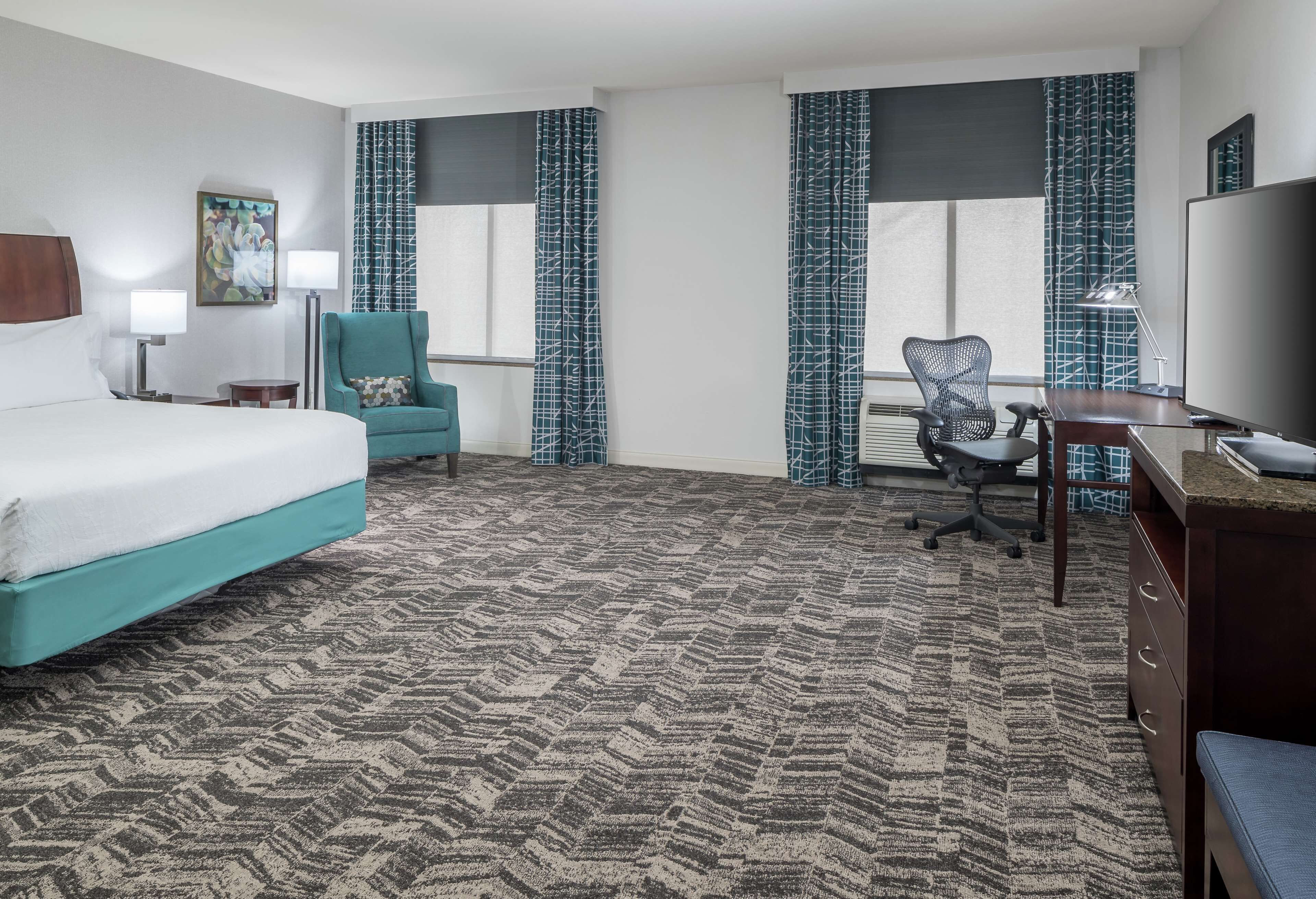 premium bedding, desk, laptop workspace, blackout curtains