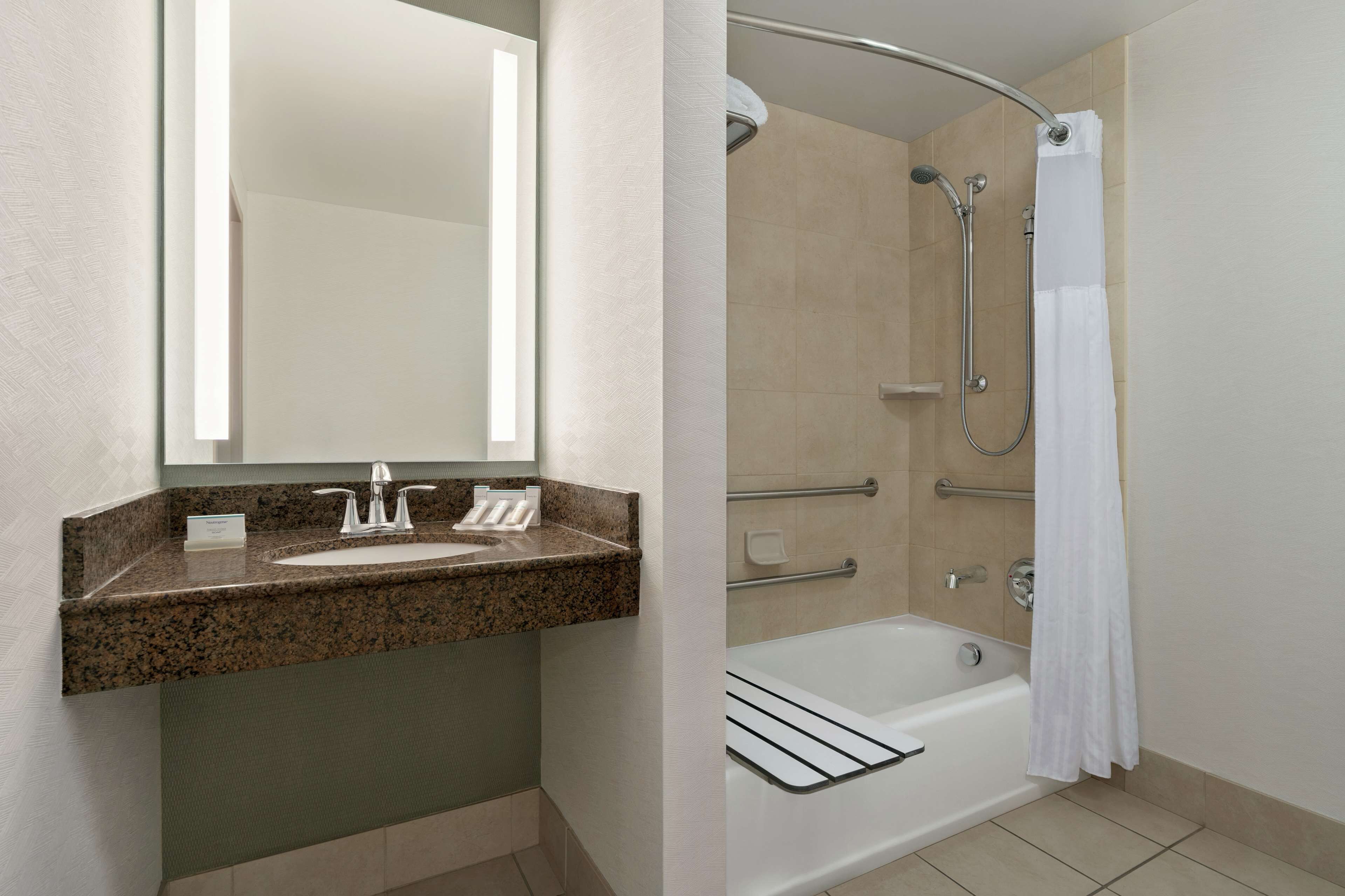 combined shower/bathtub, hair dryer, bathrobes, towels