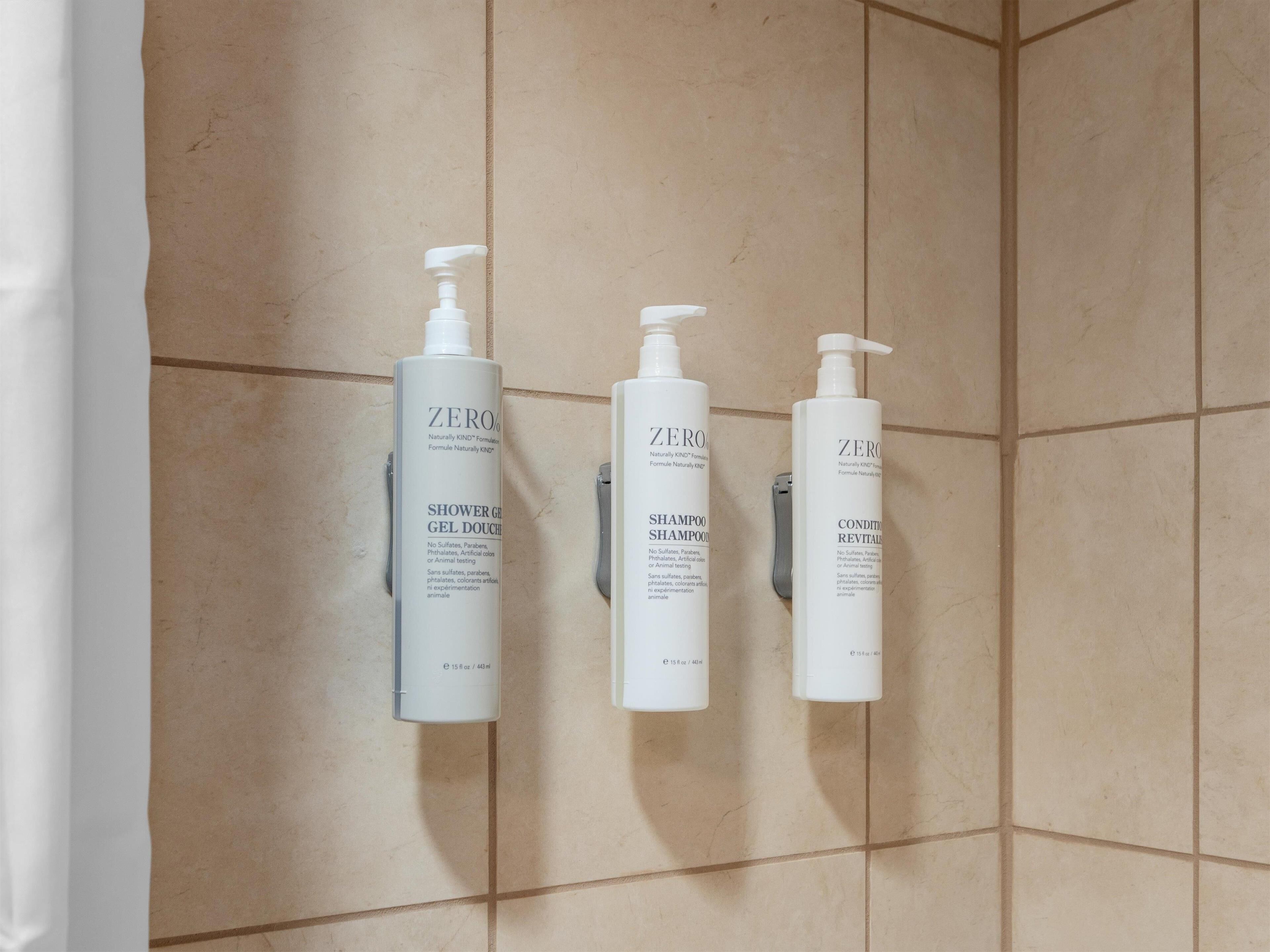 combined shower/bathtub, designer toiletries, hair dryer, towels