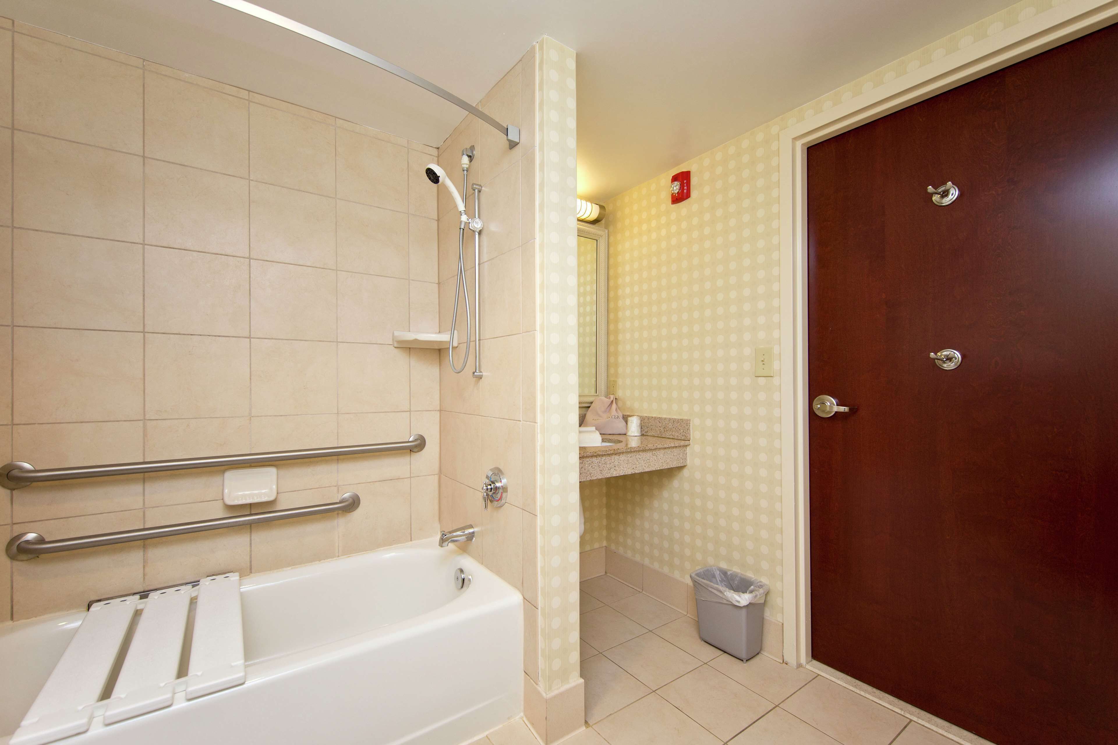 combined shower/bathtub, designer toiletries, hair dryer, towels