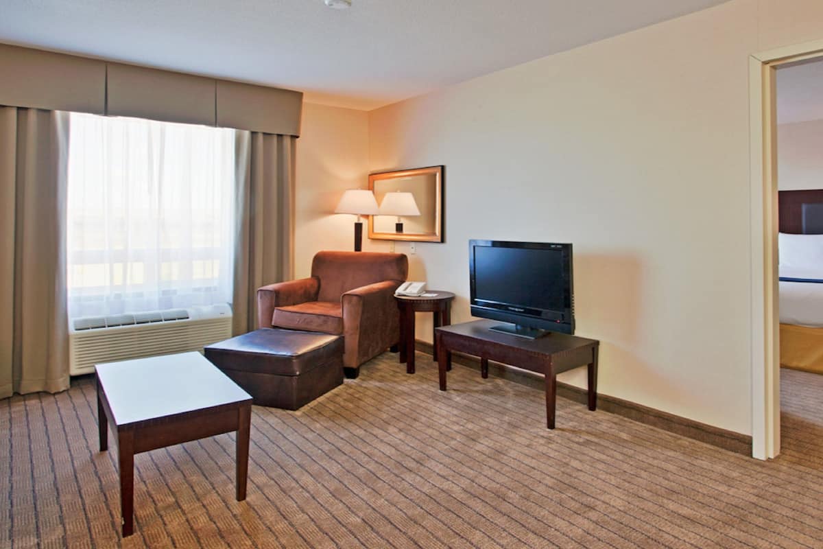 pillow-top beds, desk, laptop workspace, blackout curtains