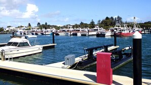 A marina with several boats docked at the pier.