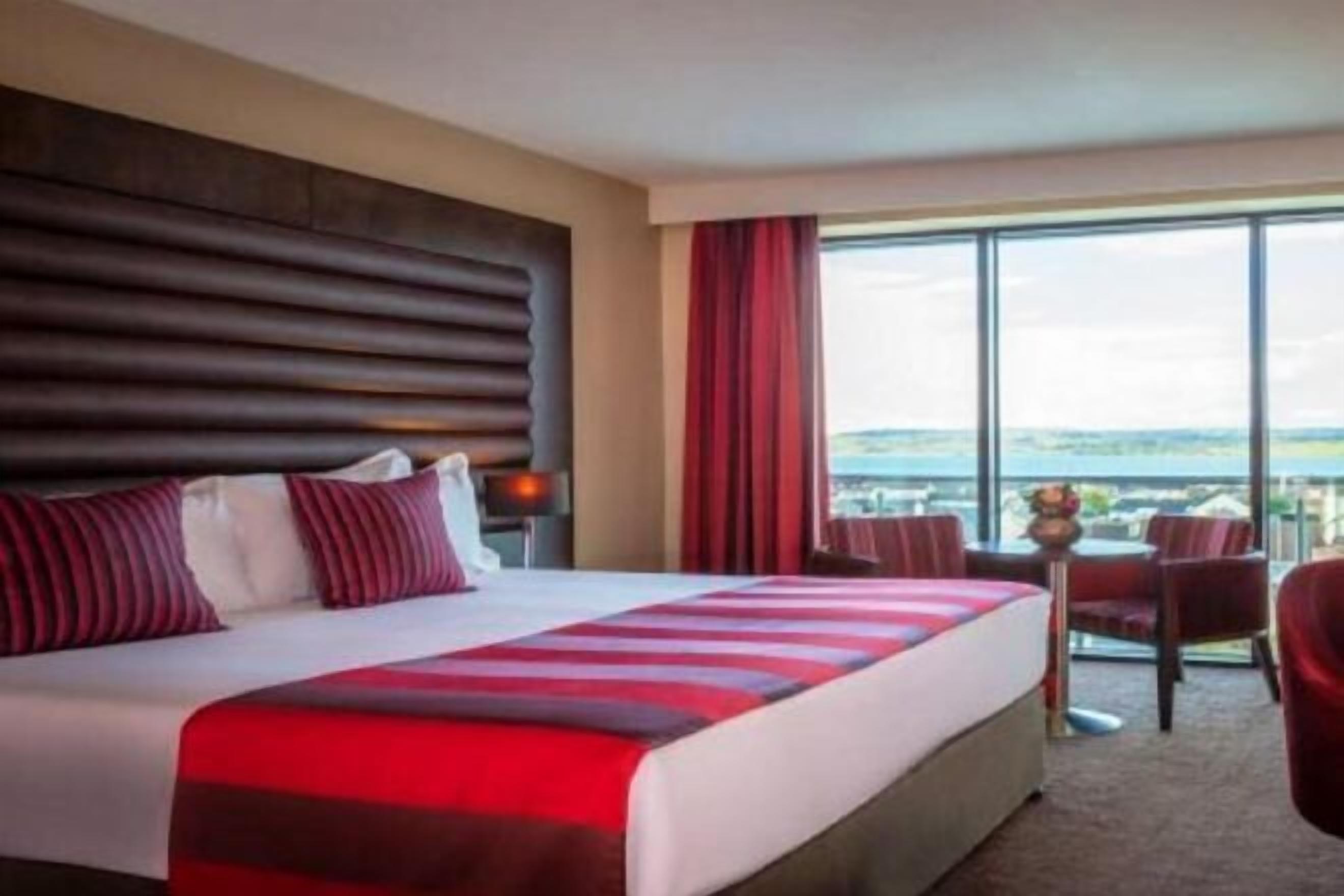 Hypo-allergenic bedding, desk, laptop workspace, blackout curtains