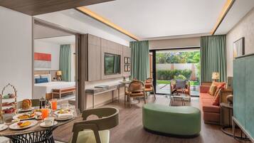Luxury Suite (Luxury) | Living area | 36-inch flat-screen TV with satellite channels, TV, table football