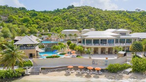 A resort with a pool, beach, and lush greenery. - Scrub Island Resort, Spa & Marina (Scrub Island)