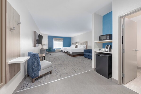 A hotel room with two beds, a desk, a microwave, and a refrigerator. - Holiday Inn Express & Suites Granbury by IHG (Granbury)