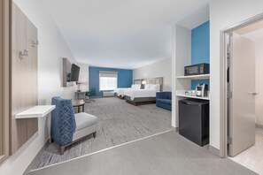 A hotel room with two beds, a desk, a microwave, and a refrigerator. - Holiday Inn Express & Suites Granbury by IHG (Granbury)