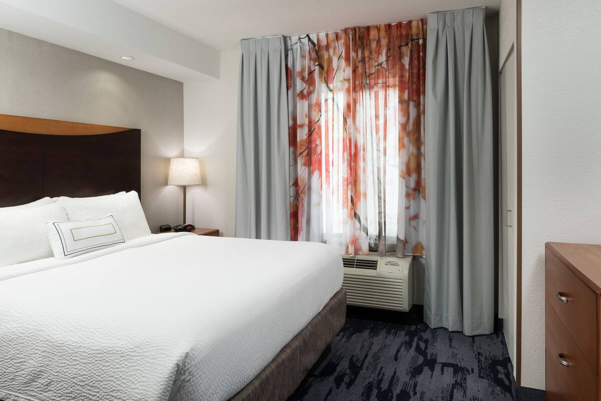 desk, laptop workspace, blackout curtains, iron/ironing board