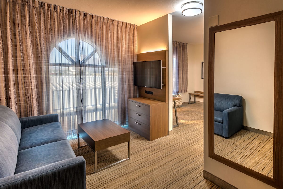 suite, 1 king bed, jetted tub | 1 bedroom, in-room safe, desk, iron/ironing board