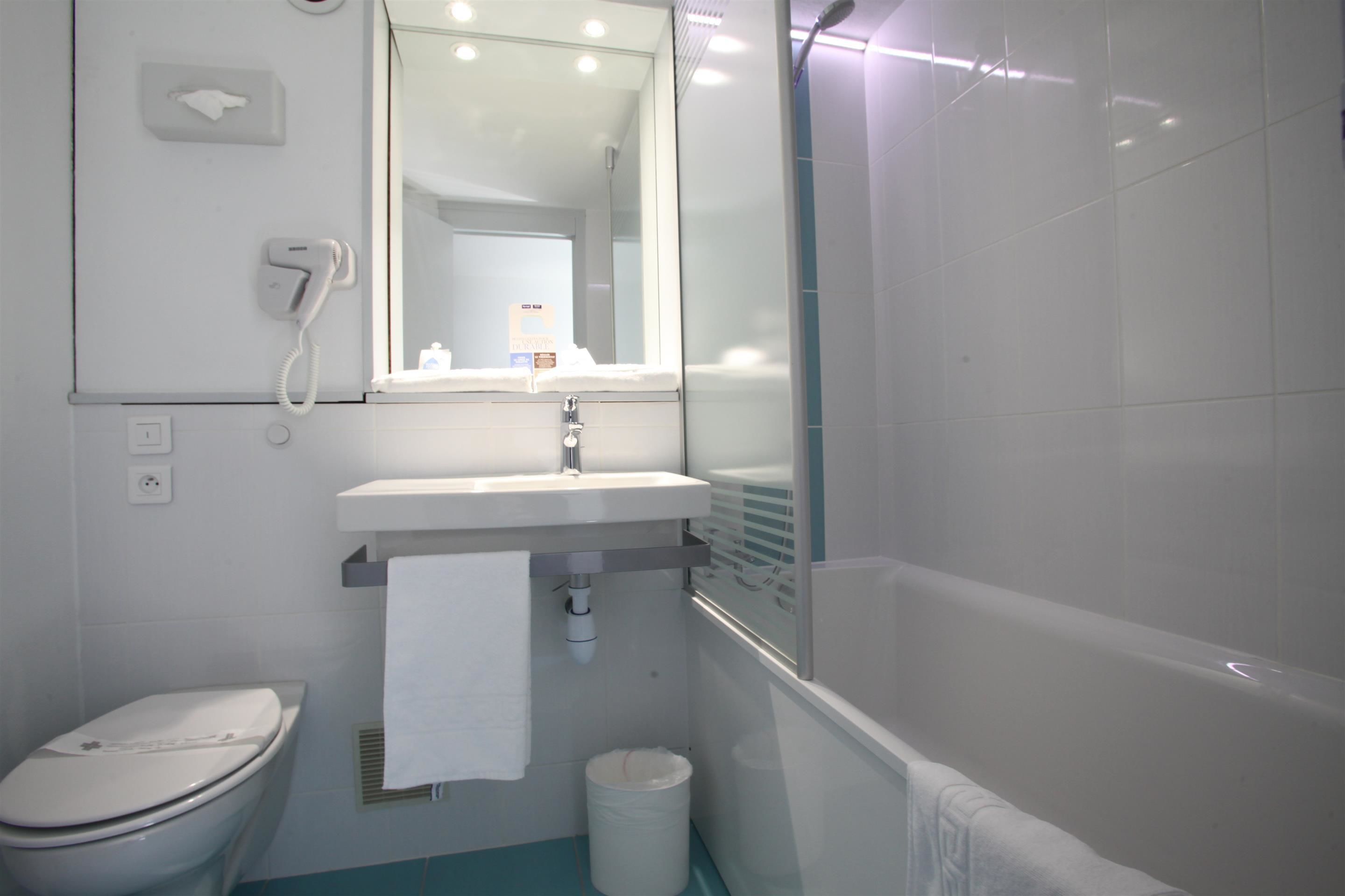 eco-friendly toiletries, hair dryer, towels