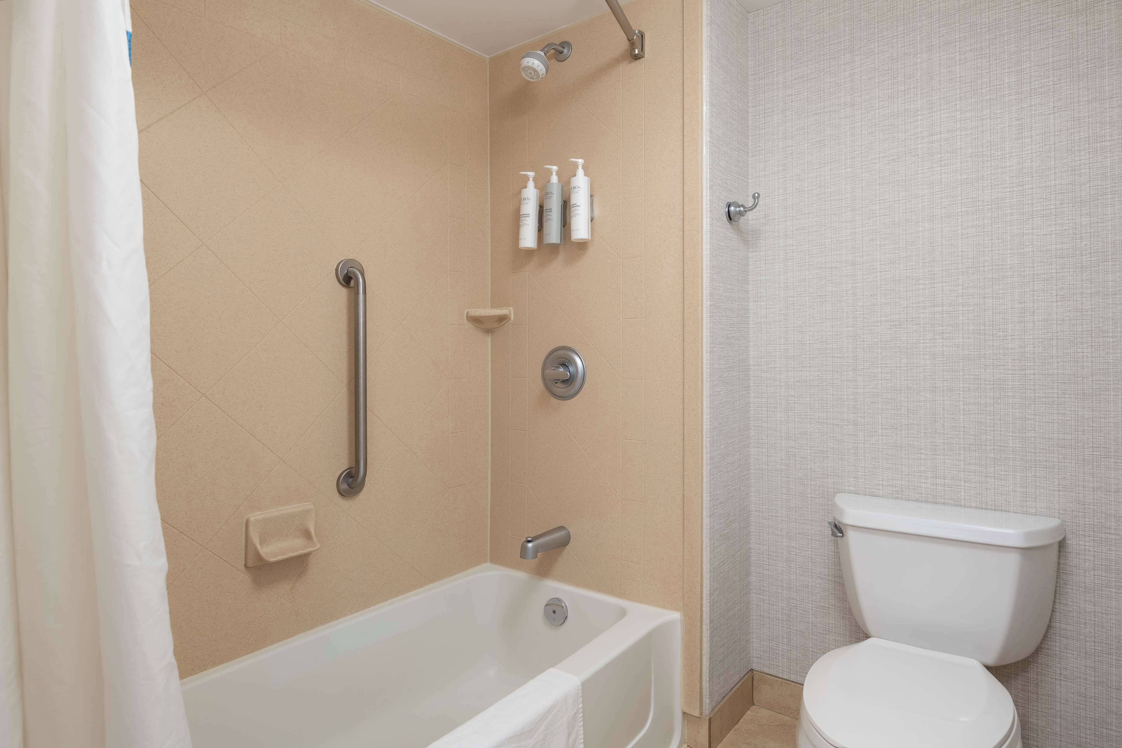 one king studio suite non smoking | bathroom | combined shower/bathtub, hydromassage showerhead, free toiletries