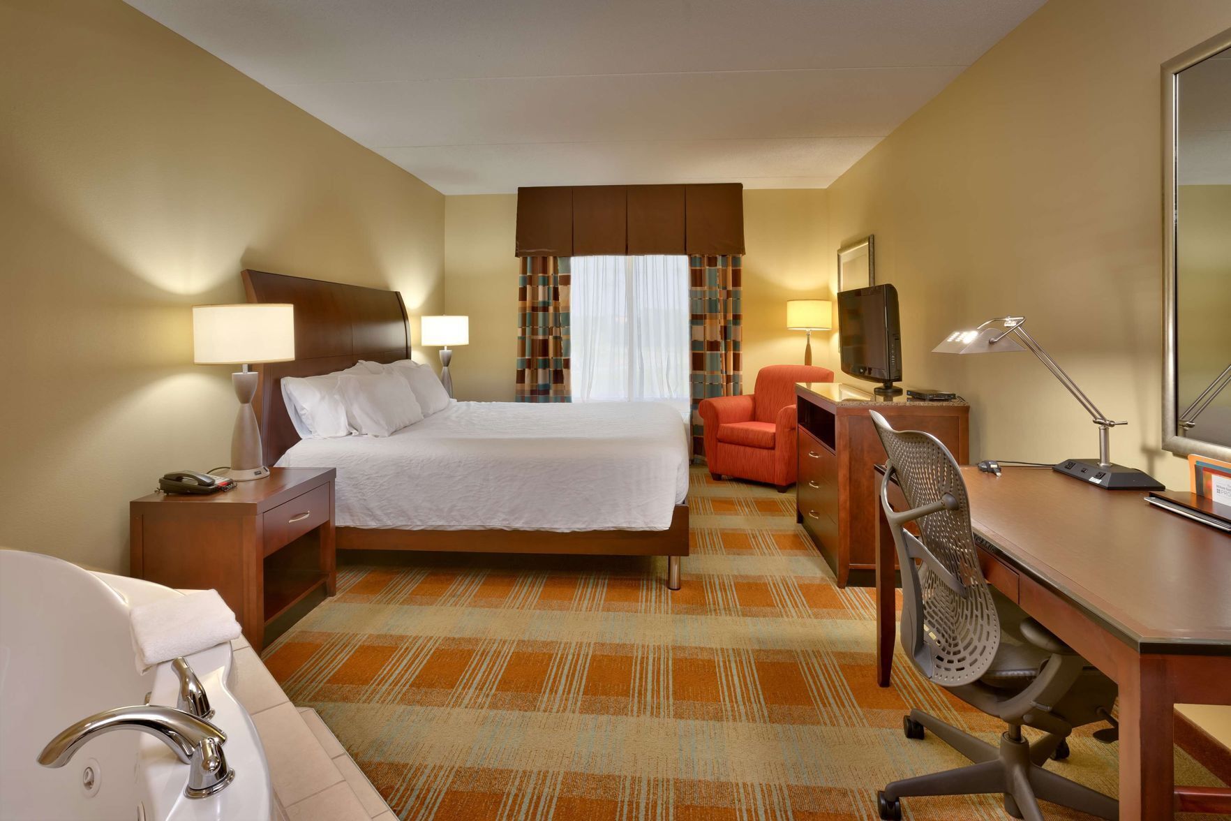 Premium bedding, down duvets, in-room safe, desk
