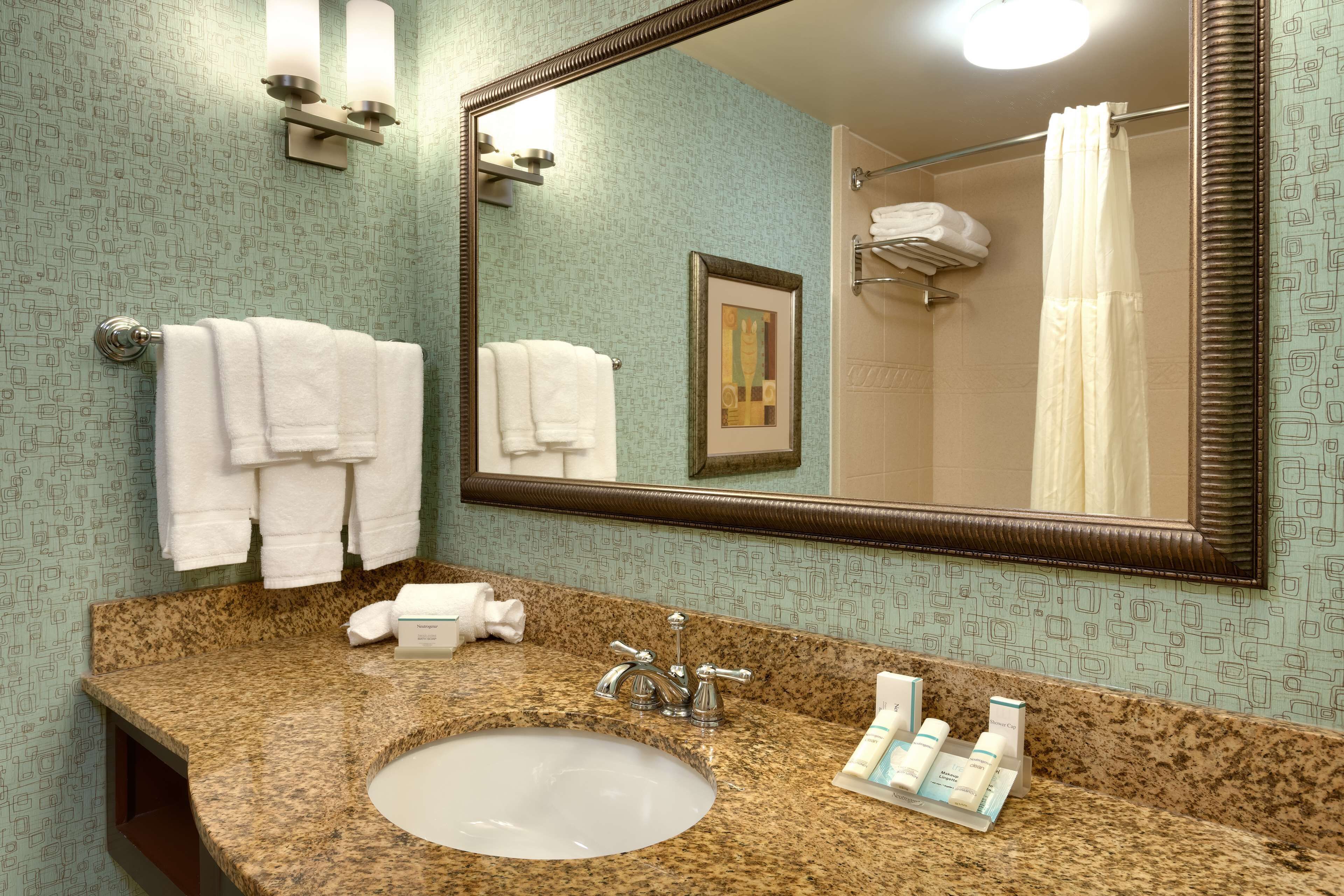 combined shower/bathtub, designer toiletries, hair dryer, towels