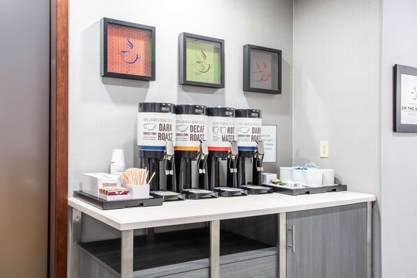 A coffee station with multiple coffee dispensers labeled 'Dark Roast' and 'Decaf Roast'. - Hampton Inn Elkins (Elkins)