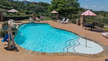 Outdoor pool, open 8:00 AM to 10:00 PM, pool loungers