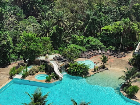 Outdoor pool, sun loungers. Sabah Hotel Sandakan