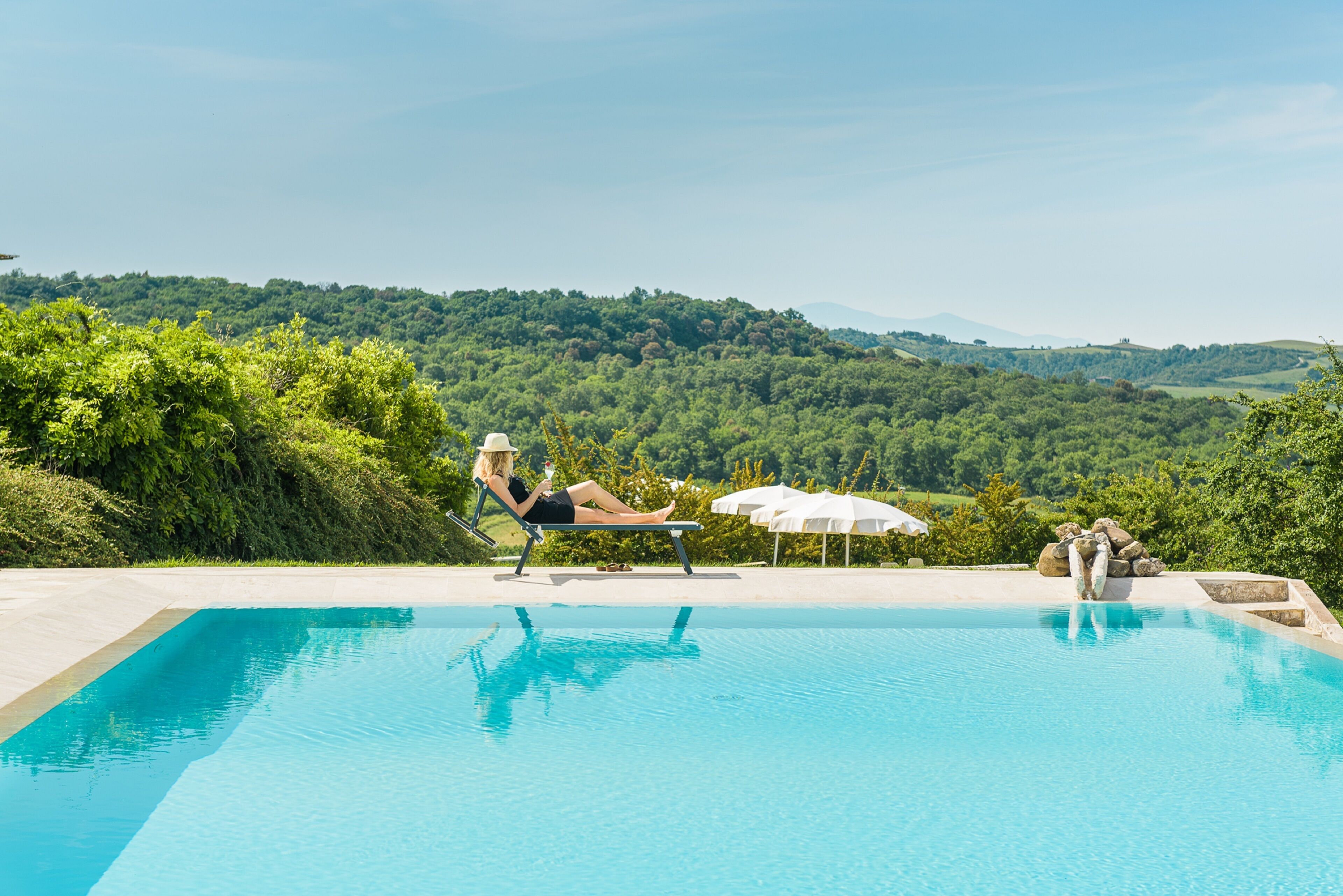 outdoor pool, an infinity pool, pool loungers
