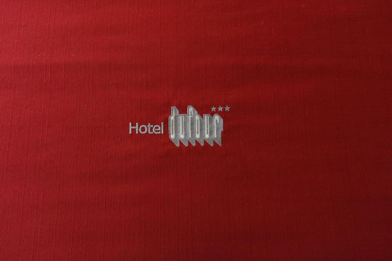 A red fabric with a hotel logo and three stars.
