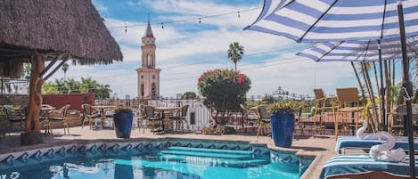 Outdoor pool, open 6:00 AM to 7:30 PM, pool umbrellas, pool loungers