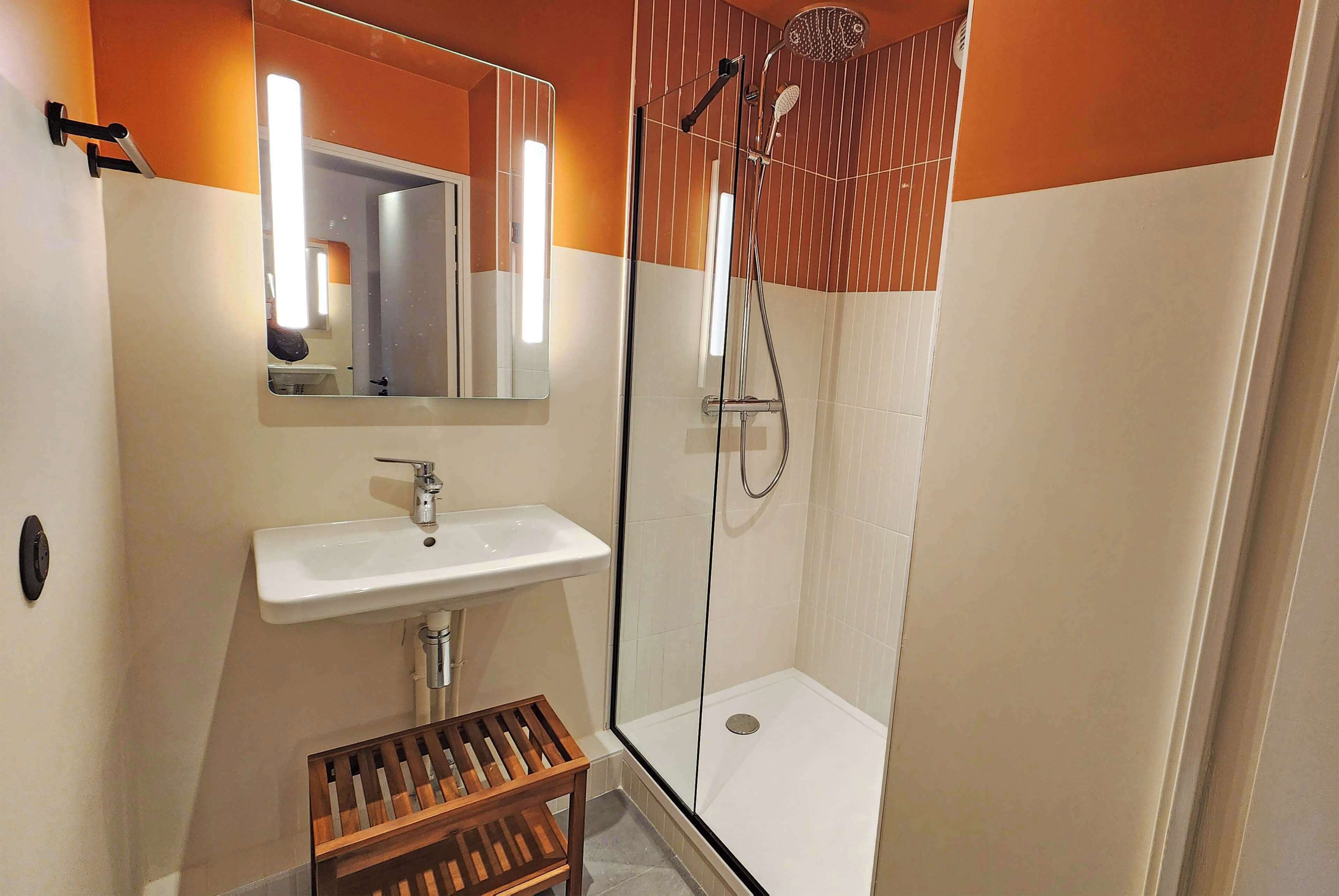 junior suite, 1 queen bed with sofa bed | bathroom | eco-friendly toiletries, hair dryer, towels, soap