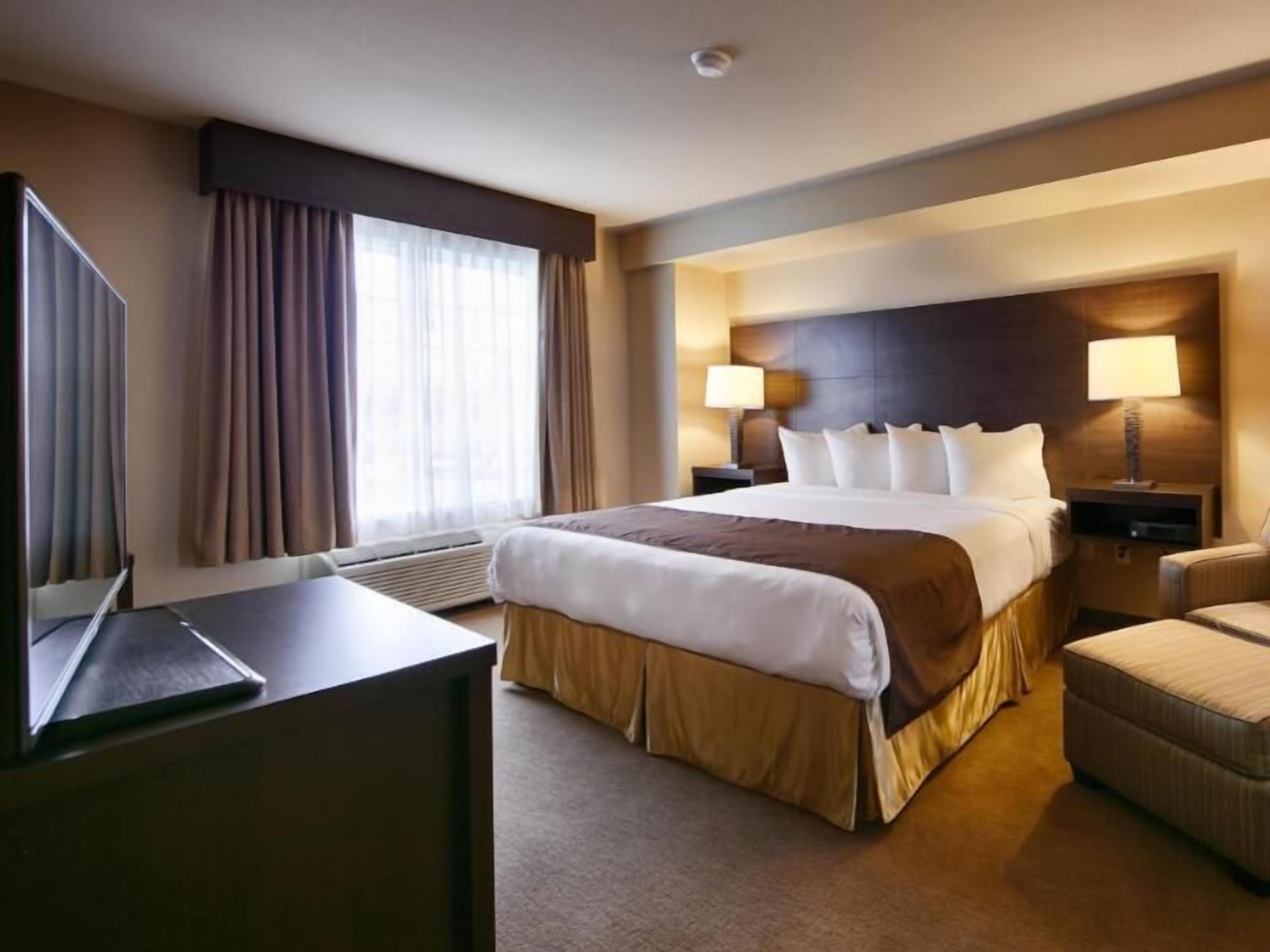 Desk, laptop workspace, blackout drapes, iron/ironing board