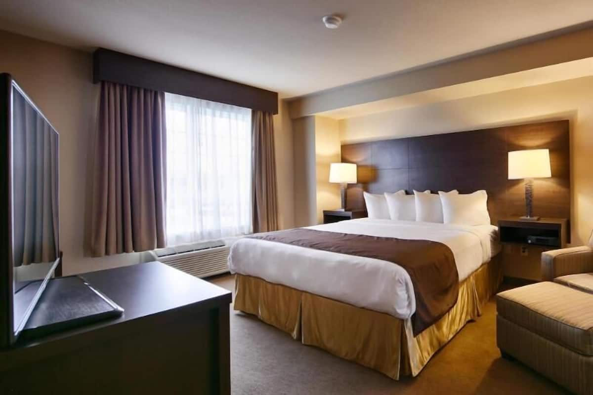 Desk, laptop workspace, blackout drapes, iron/ironing board