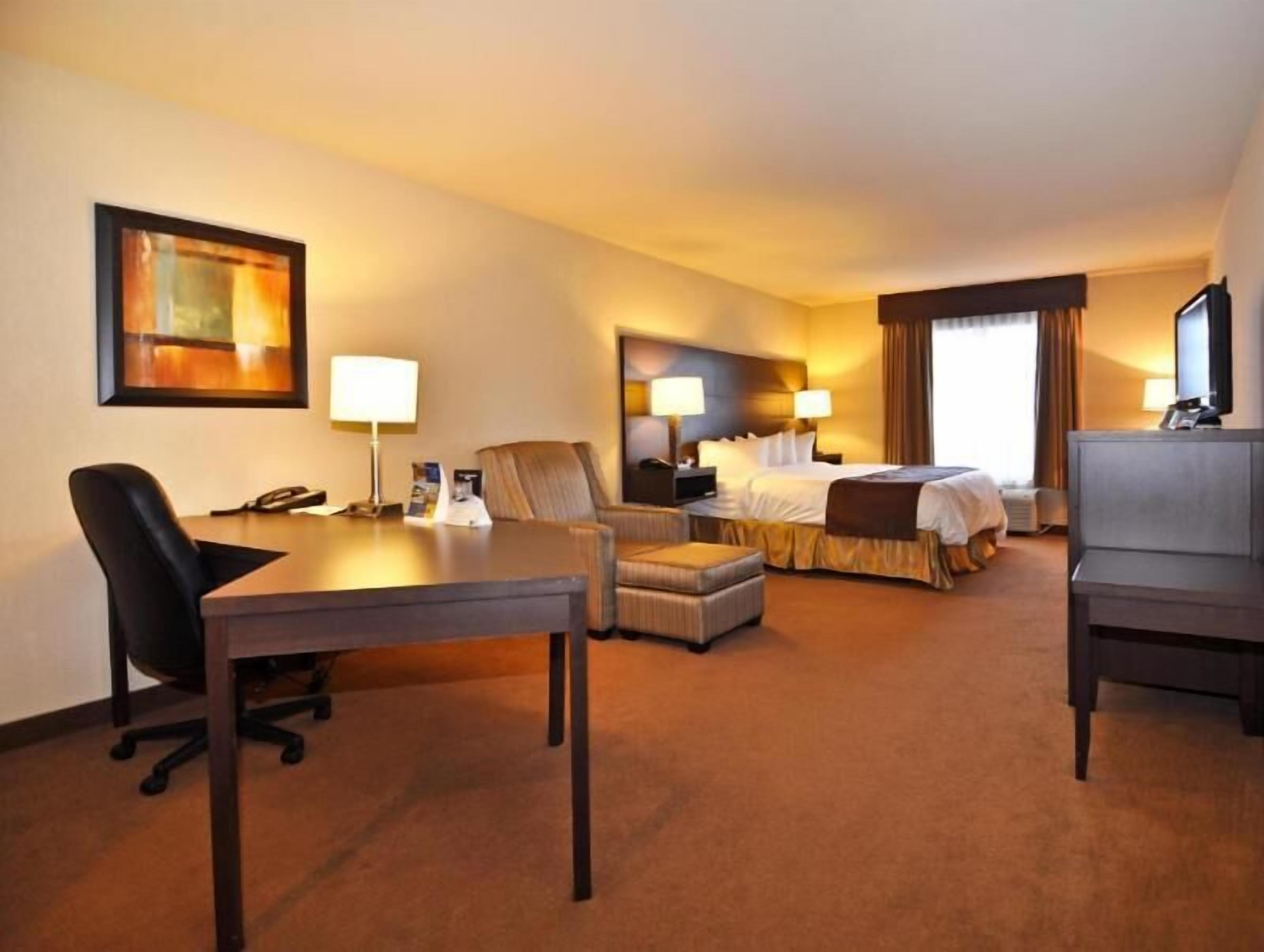 Desk, laptop workspace, blackout drapes, iron/ironing board