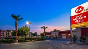 A hotel entrance with a sign for Best Western Plus Main St Inn. - Best Western Plus Main Street Inn (Brawley)