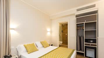 Luxe beddengoed, een minibar, een kluis op de kamer