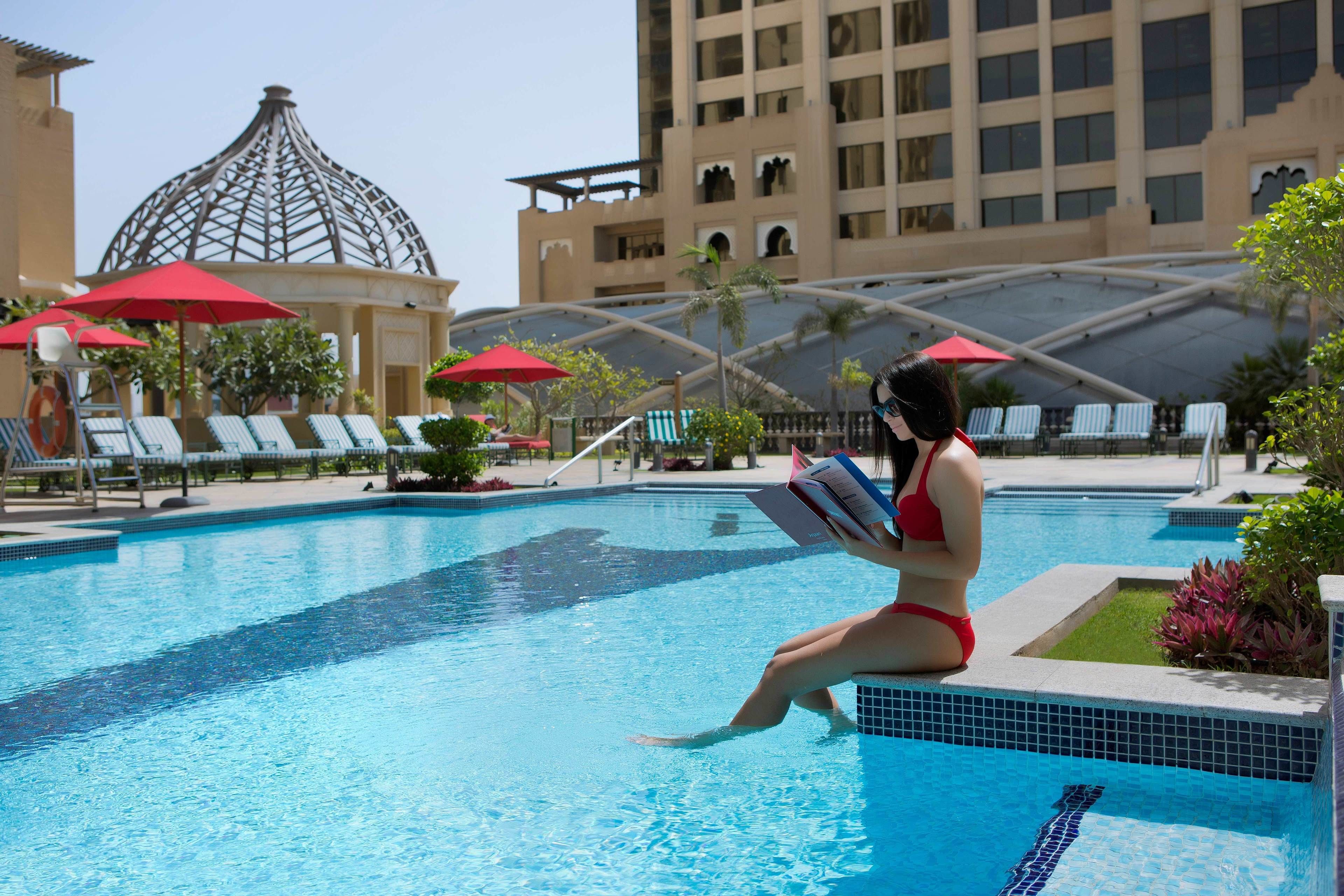 Outdoor pool, open 8:00 AM to 8:00 PM, pool umbrellas, pool loungers