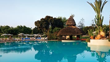 Indoor pool, pool umbrellas, pool loungers