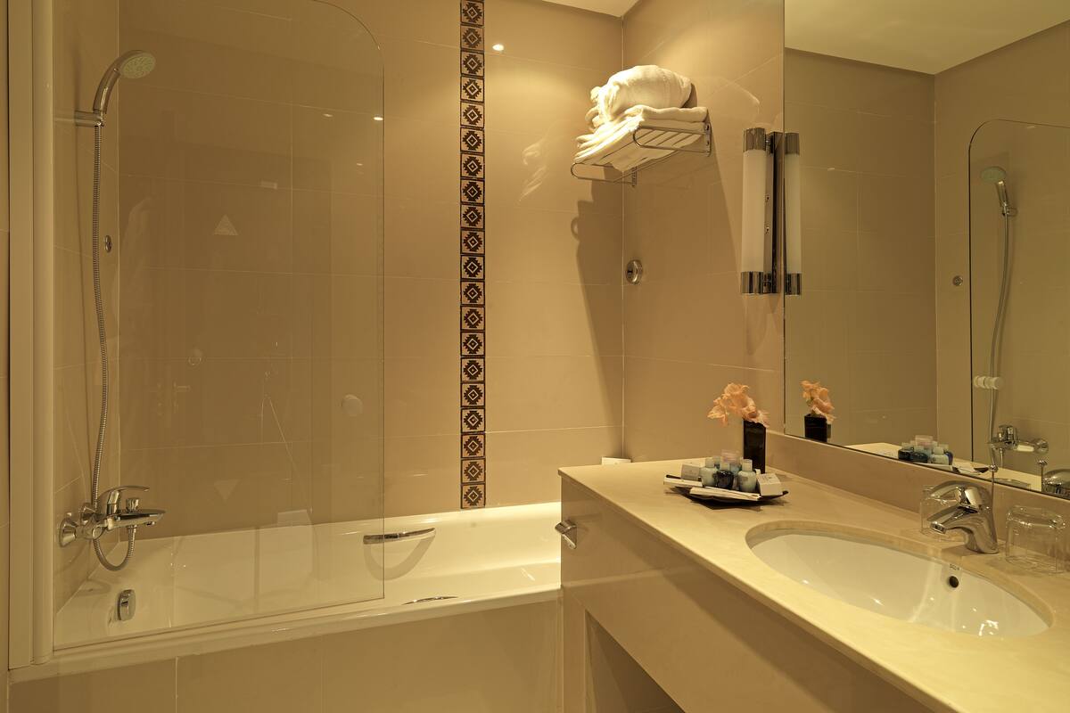 bathtub, free toiletries, hair dryer, bathrobes