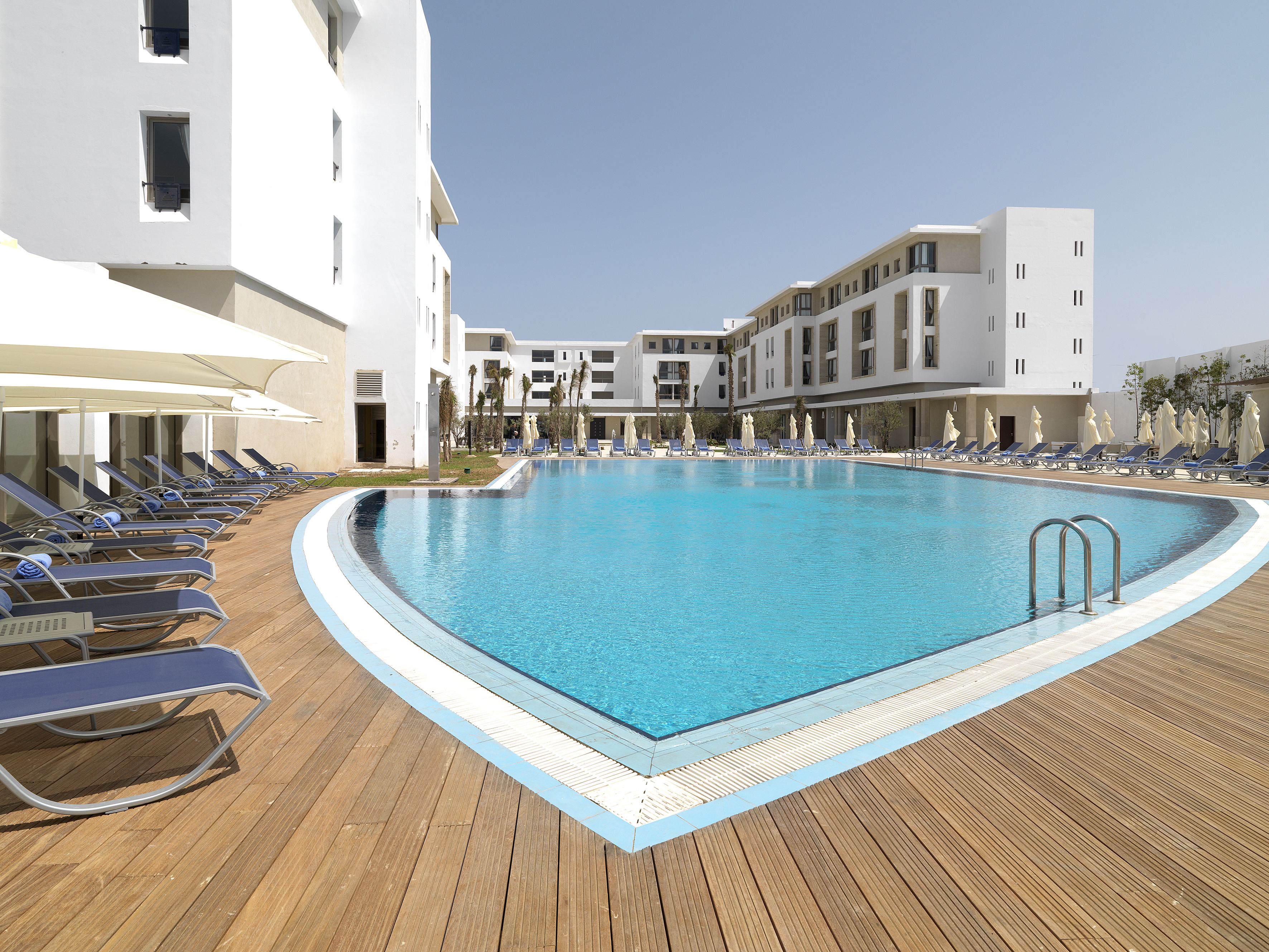 Outdoor pool, pool umbrellas, sun loungers