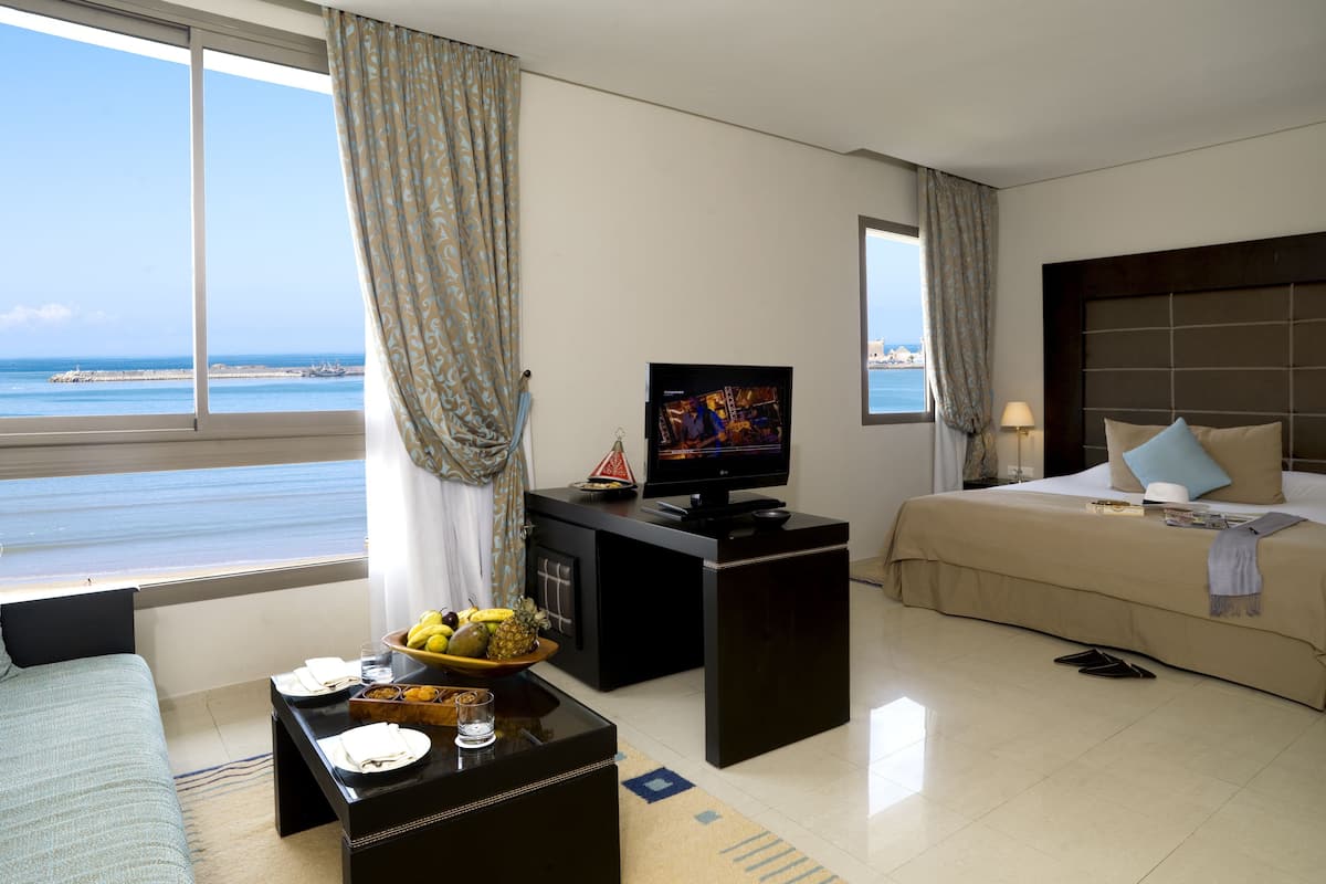 deluxe room, sea view | 1 bedroom, premium bedding, minibar, in-room safe