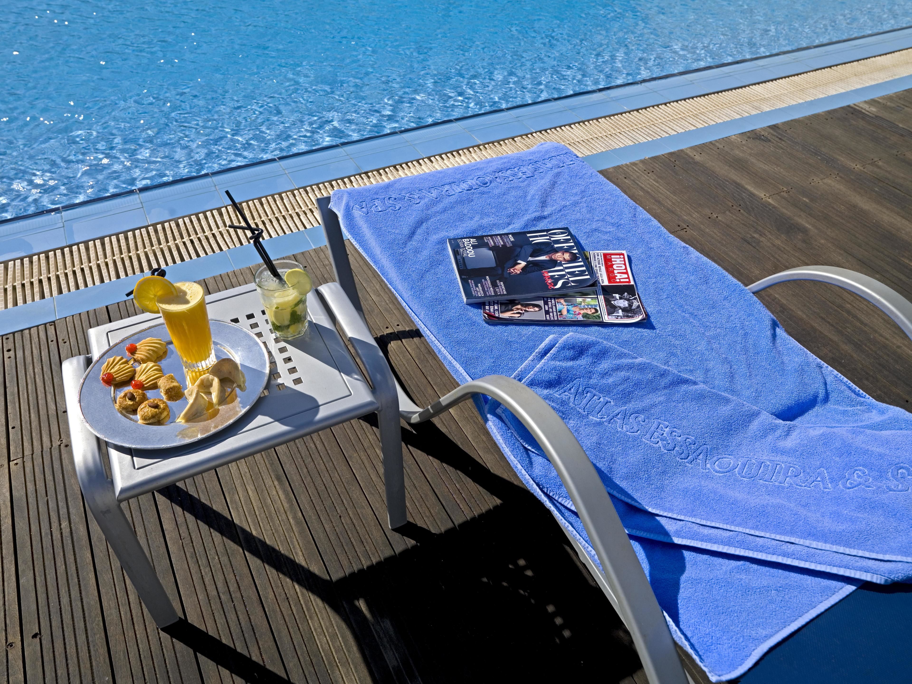 outdoor pool, pool umbrellas, pool loungers