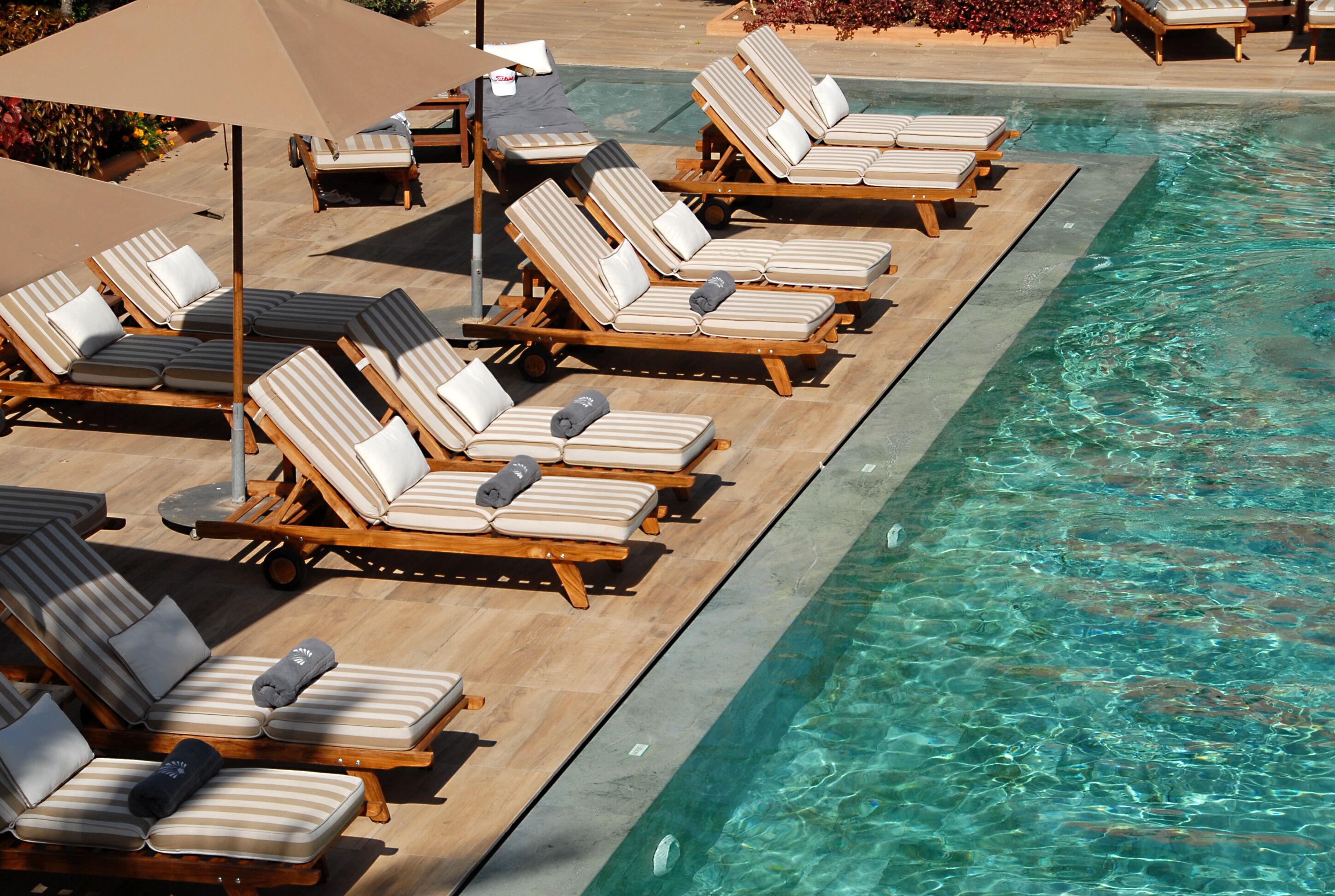 indoor pool, outdoor pool, pool umbrellas, pool loungers