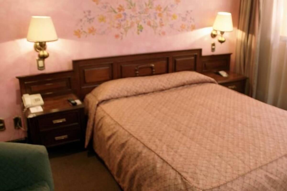 1 dormitorio y ropa de cama de alta calidad