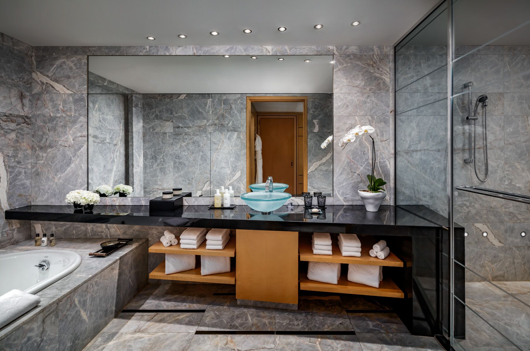 Separate bathtub and shower, deep-soaking bathtub, designer toiletries