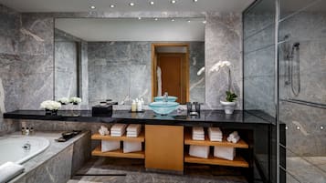 Separate bathtub and shower, deep-soaking bathtub, designer toiletries
